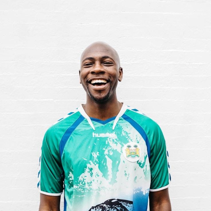 A. Smith, Lead Design Curator at Nova Lexic Fusion, reviewing corporate floral arrangements